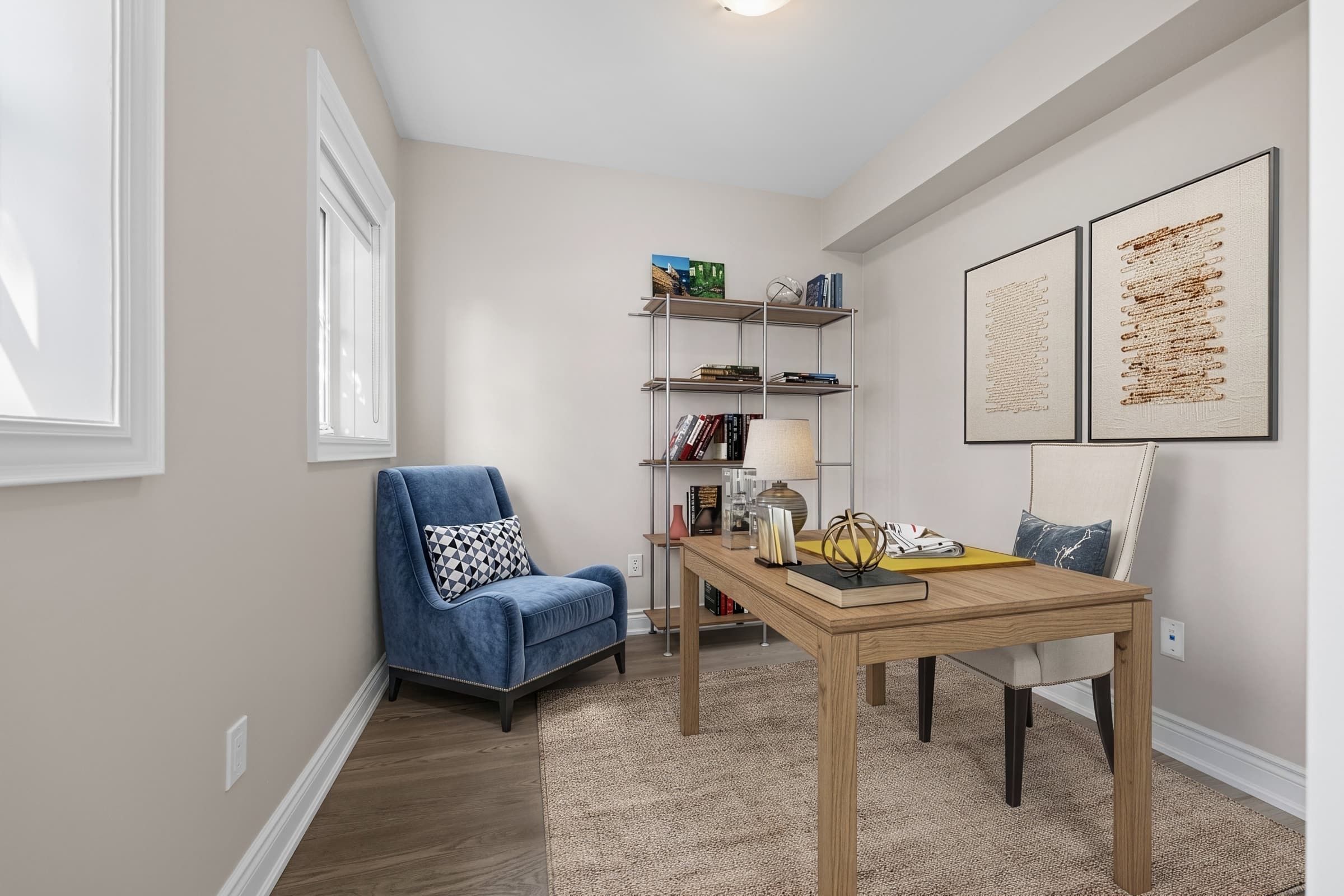 Home office virtually staged with a desk, chairs, shelving and decor