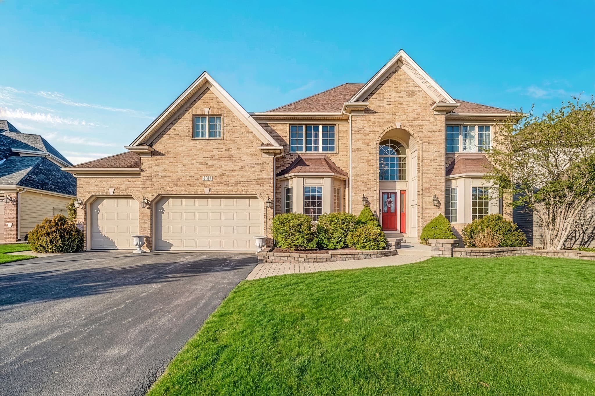 Enhanced exterior real estate photo after lighting, color, and clarity correction